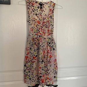 Cute white dress with black and red specks.  Shiny red little buttons